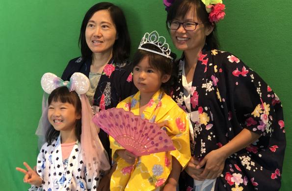 family posing for a picture at the 2019 Natsumatsuri Family Festival summer photo booth