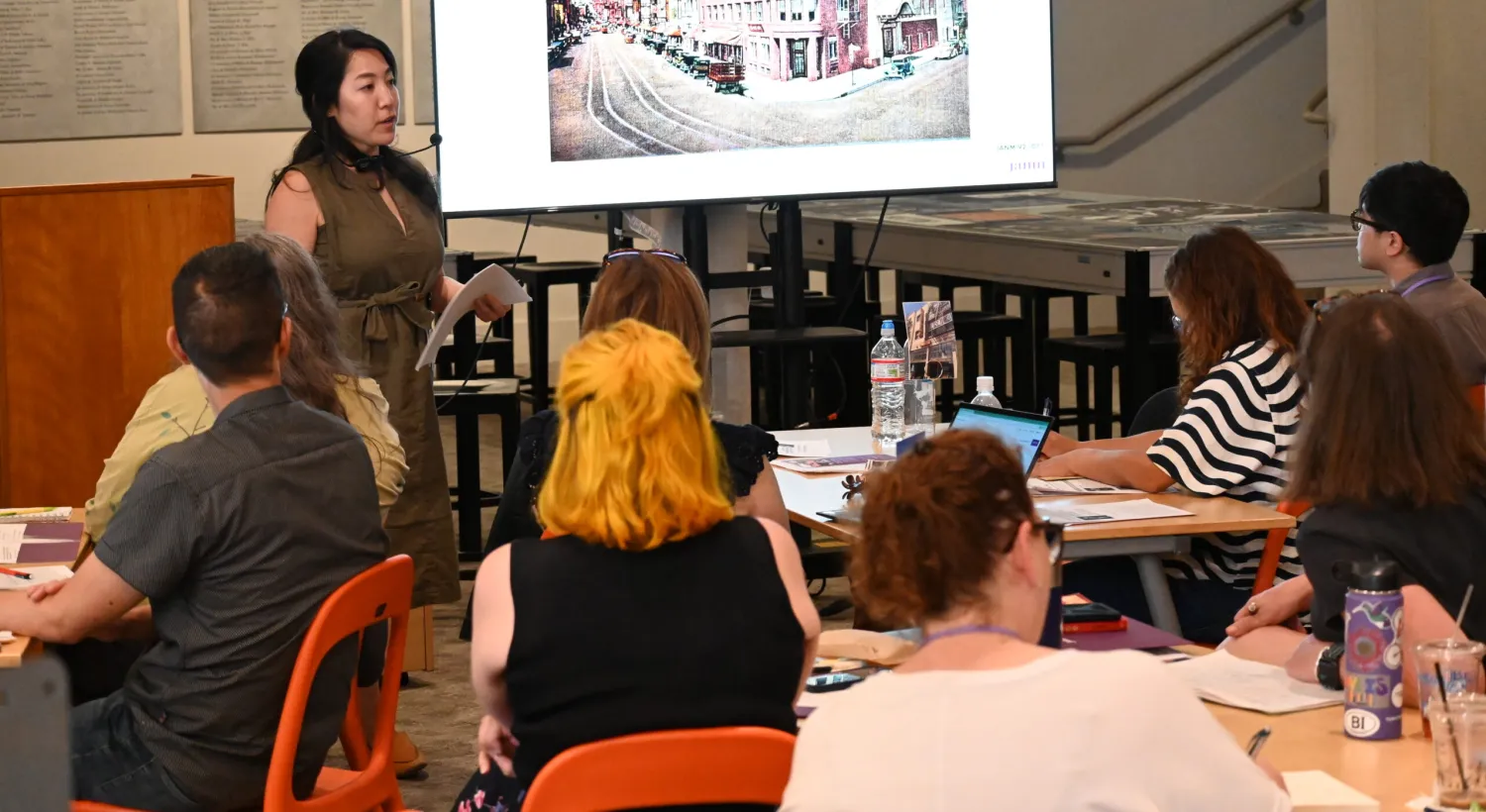 NEH workshop speaker and seated teachers