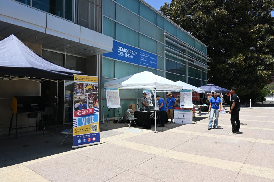 the Democracy building with voting information tents in front