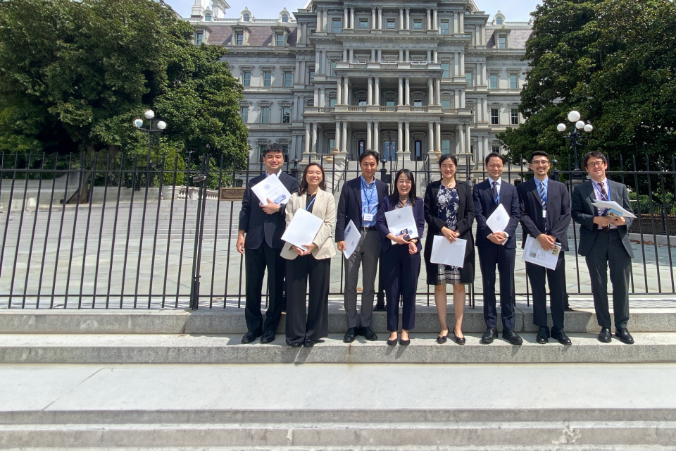 Group of young adults in front of a historic building