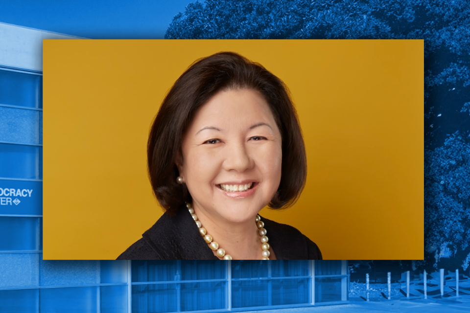 irene hirano headshot with democracy center building in background