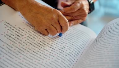 hands stamping the ireicho book